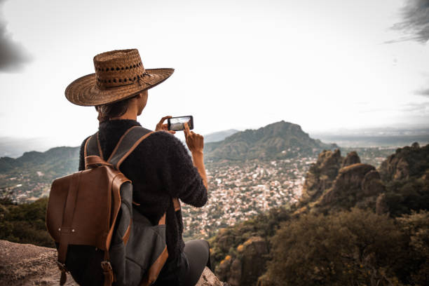 istock Tourist woman making a photo. 1074043844