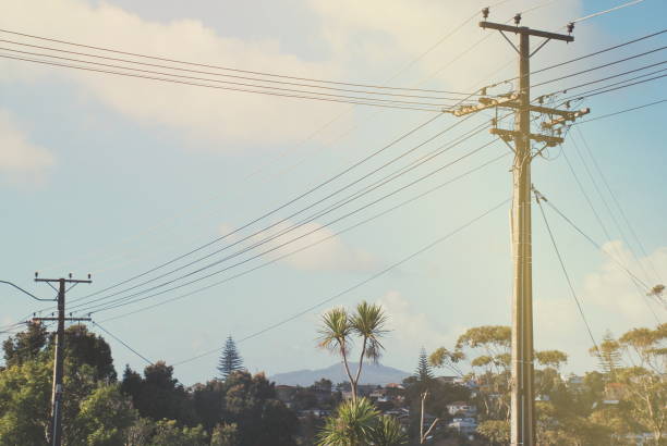 Power Line in Urban Scene, New Zealand A Power Line or Electricity in a Urban New Zealand Landscape. power line photos stock pictures, royalty-free photos & images