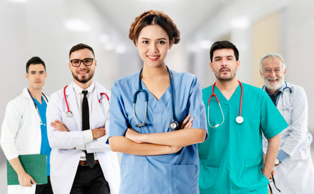 istock Doctor working in hospital with other doctors. 1074047120