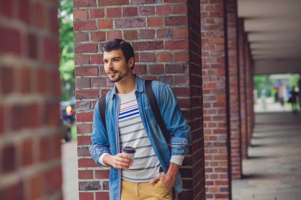 istock casual young man outdoors 1074049346