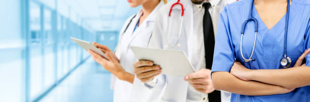 istock Doctor working in hospital with other doctors. 1074049396