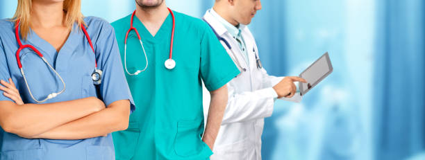 istock Doctor working in hospital with other doctors. 1074049464