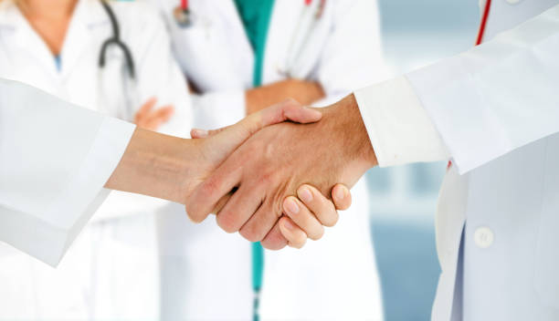 istock Doctor working in hospital with other doctors. 1074049520