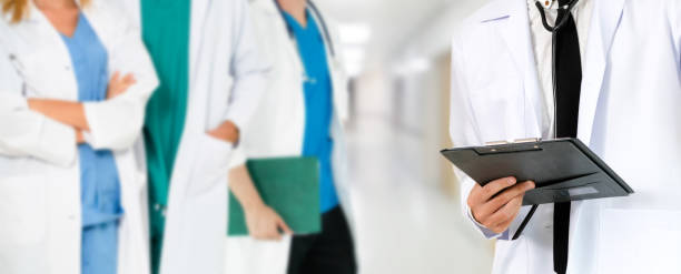 istock Doctor working in hospital with other doctors. 1074049522