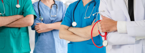 istock Doctor working in hospital with other doctors. 1074049542