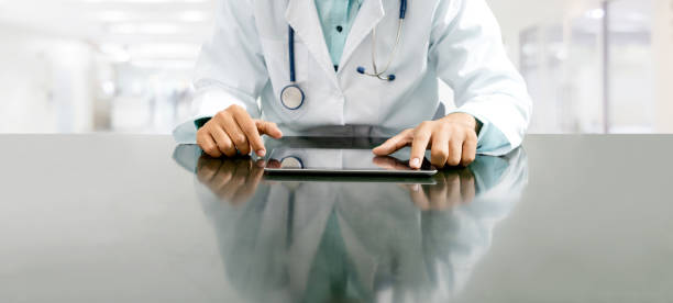 istock Doctor with tablet computer at hospital office. 1074065398