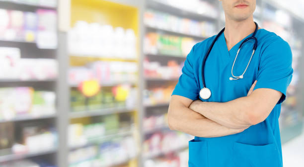 istock Male pharmacist working at the pharmacy. 1074065668