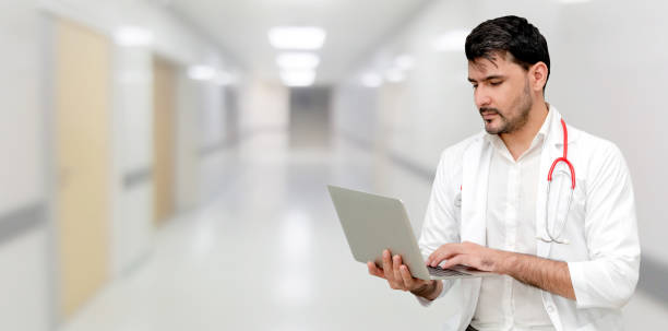 istock Doctor using laptop computer at the hospital. 1074065990