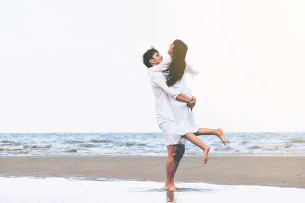 istock Couple going honeymoon on tropical beach in summer 1074072528