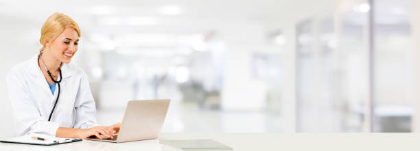 istock Doctor using laptop computer at the hospital. 1074076618