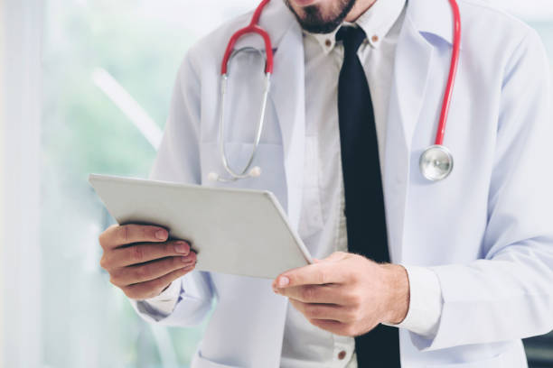 istock Doctor working on tablet computer in the hospital. 1074076934