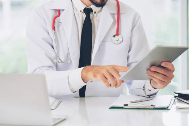 istock Doctor working on tablet computer in the hospital. 1074076978