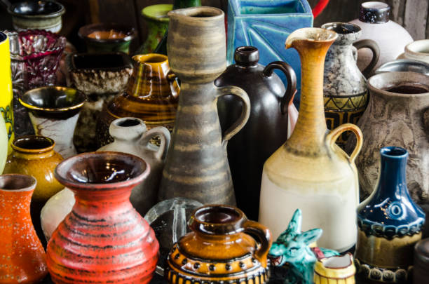 istock FLEA MARKET with old pottery and ceramic vases and cups in front 1074082072