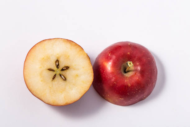 istock Small apple with green leaf on white background. ranetka 1074084200