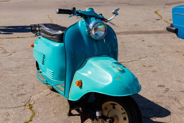 istock Blue retro scooter parked on city street 1074085630