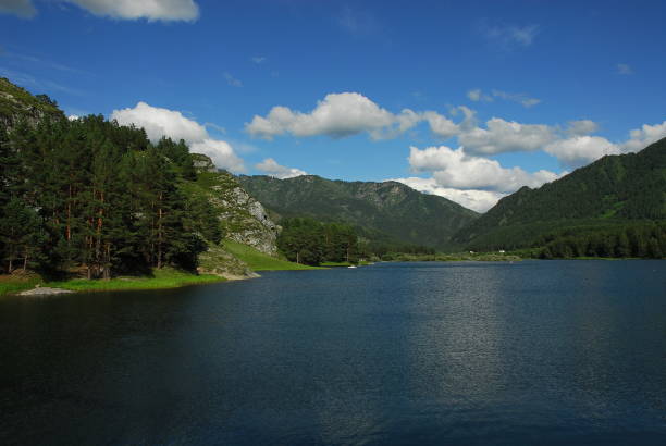 istock Lake surrounded by wooded hills. 1074088446