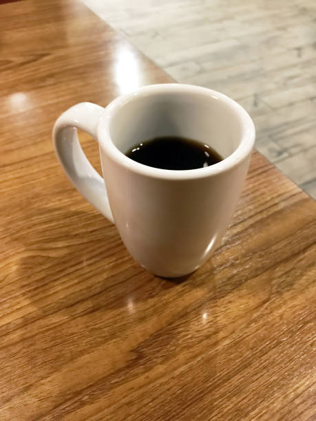 istock Cup of coffee in a diner table 1074089478
