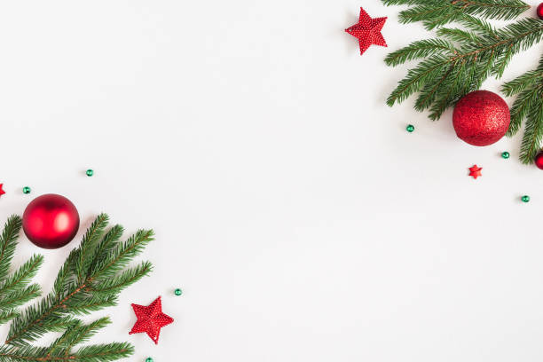 istock Christmas composition. Fir tree branches, red decorations on pastel gray background. Christmas, winter, new year concept. Flat lay, top view, copy space 1074092492
