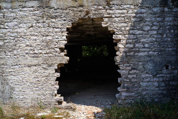 The broken hole in the wall of abandoned house.