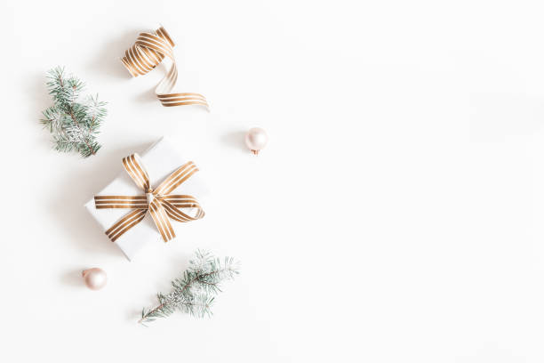 istock Christmas composition. Gift, fir tree branches, balls on white background. Christmas, winter, new year concept. Flat lay, top view, copy space 1074099476