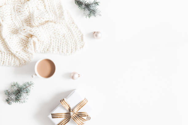 istock Christmas composition. Gift, fir tree branches, plaid, cup of coffee, balls on white background. Christmas, winter, new year concept. Flat lay, top view, copy space 1074099482