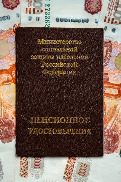 istock Russian pension certificate and currency (banknotes). 1074099868
