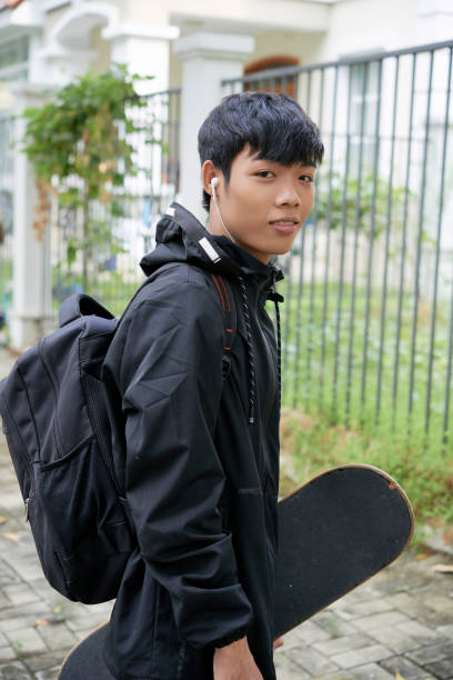 istock Teenager with skateboard 1074104598
