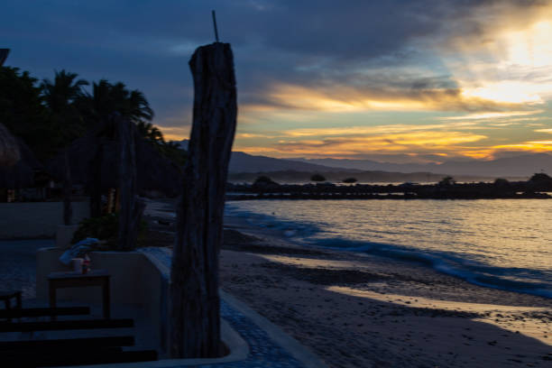 istock sun rays through the clouds from the seawall in Punta de Mita 1074106622