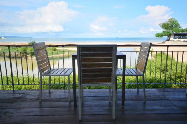 istock Restaurant tables on a tropical resort with blue sky and nice beach 1074108242