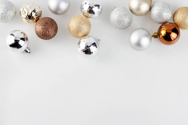 istock Gold and Silver Christmas ornament balls on clear white background 1074108534
