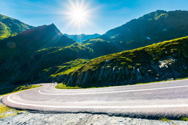 Transfagarasan road in mountains winding uphill. popular travel destination of Romania. beautiful summertime weather