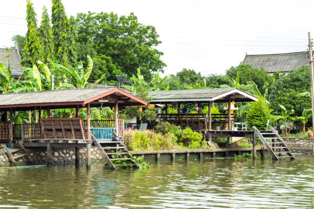 istock Classical wooden Thai House along the canal. 1074126186