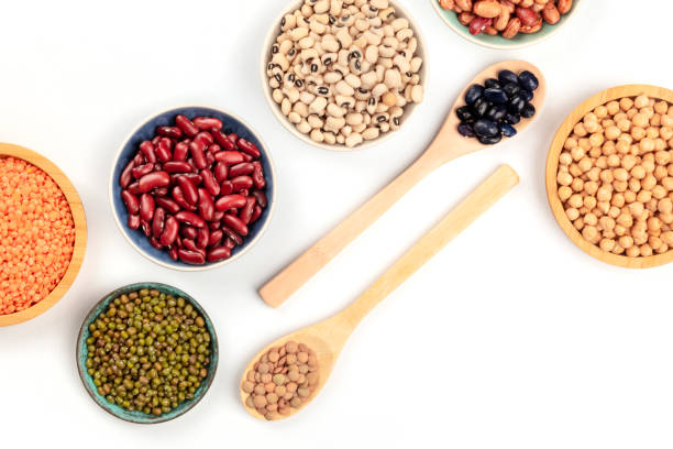 istock Various types of pulses, shot from above on a white background with copyspace. Red kidney, pinto, and black beans, lentils, chickpeas, soybeans, black-eyed peas 1074126506