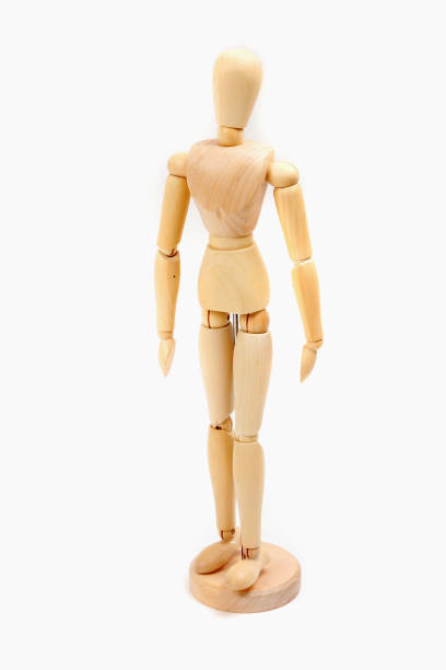 istock a wooden doll on a white background 1074130290