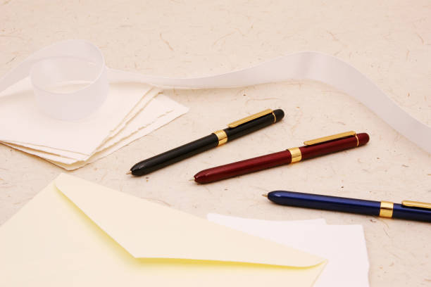 istock metal pens on paper 1074130352