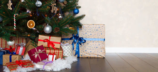 istock A pile of Christmas presents under the Tree. New Year. Background 1074130652
