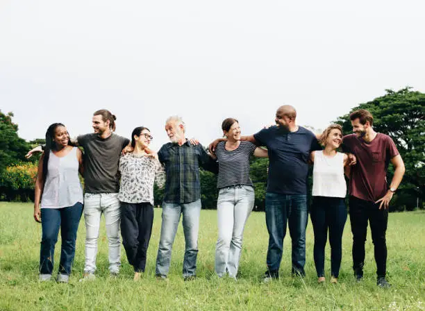 Photo of Group of people hugging each other in the park