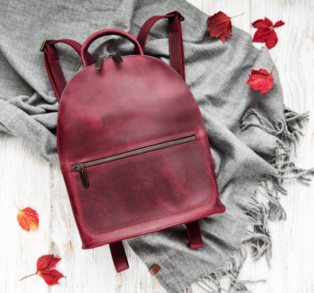 istock woman backpack with grey scarf 1074133398