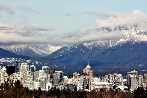 Vancouver skyline - snow capped mountain range from Queen Elizabeth Park, on a winter morning, Vancouver, Canada