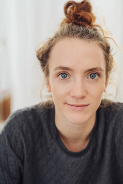 istock Pretty young woman with big blue eyes 1074146202