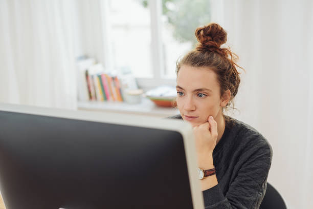 istock Young woman concentrating on her work 1074146360