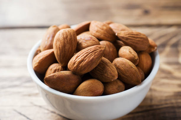 istock Almonds in a bowl. Selective focus Close up 1074147916
