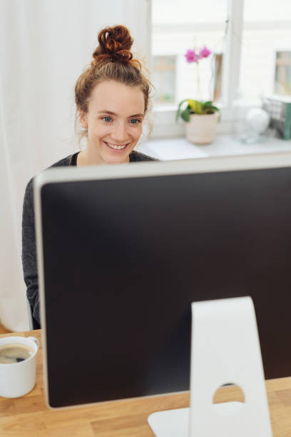 istock Happy hardworking young businesswoman 1074147974