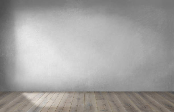istock Gray wall in an empty room with a wooden floor 1074148390
