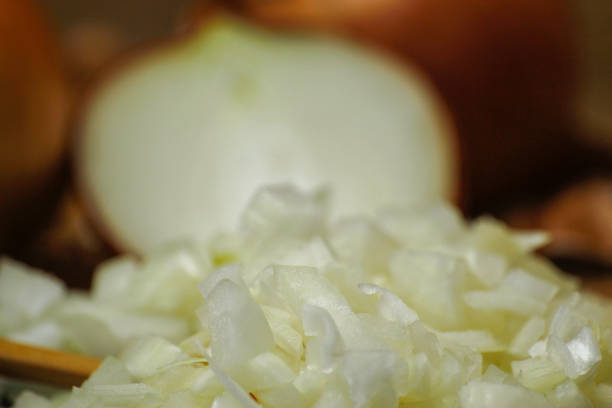 istock Onion and onion sliced on a rustic wood table 1074152648