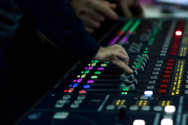 istock Close up of child adjusting volume on audio mixer. 1074164084