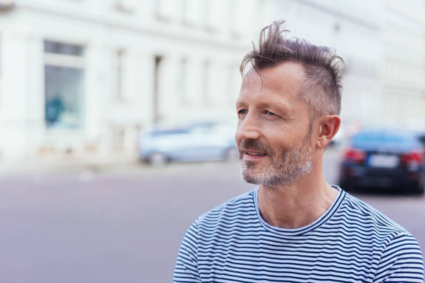 istock Thoughtful man watching something in the street 1074164186