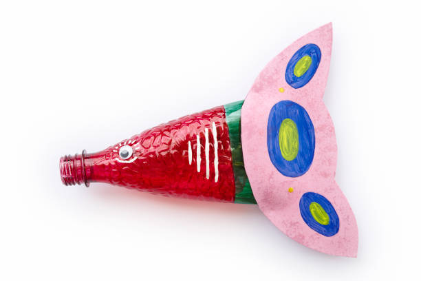 istock Plastic bottle recycled in a fish figure. Reuse garbage 1074164694