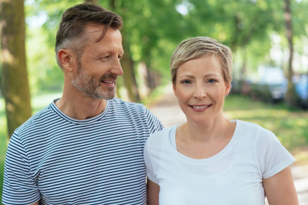 istock Smiling friendly blond woman with her husband 1074166078