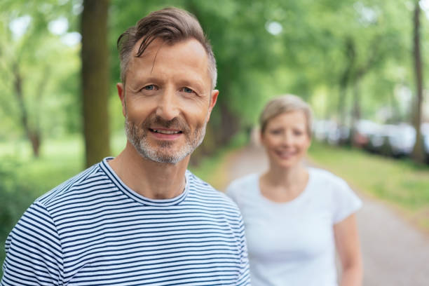 istock Portrait of a handsome middle-aged man smiling 1074166276